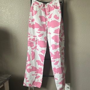 Cow print cargo pants pink and white.